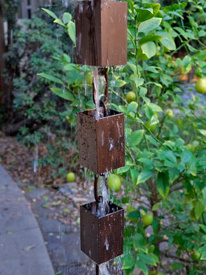 Square Kenchiku Aluminum Bronze Rain Chain with water running through multiple cups